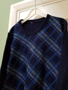 Unworn European fashion from the 1970s! Children's knitted navy blue jumper with an Argyle-style pattern to the front in light blue and white. Long sleeves, crew-neck collar. Ribbed collars and cuffs. No care label but it feels like a light cotton. This piece has never been worn. Size label reads '1'. Measurements are as follows: Shoulder to hem: 20" / 51 cm Shoulder to cuff:  20" / 51 cm Chest:  27" / 68.5 cm Waist:  11.5" / 29 cm As this is a vintage item, it may have a slightly musty smell. T Blue Jacquard Knit Sweater For Fall, Blue Knitted Wool Tops, Blue Jacquard Knit Crew Neck Sweater, Blue Wool Long Sleeve Tops, Retro Blue Knitted Sweater, Retro Blue Long Sleeve Sweater, Blue Wool Knit Sweater, Blue Long Sleeve Retro Sweater, Retro Blue Crew Neck Sweater