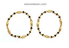 22 karat fine gold baby nazaria - set of 2(1 pair)
  length : 4.60 inches

enhance your child's beauty with 22 karat fine gold baby nazaria  indulge your little one with the exquisite beauty of indian craftsmanship with this stunning set of 2(1 pair) 22 karat fine gold baby nazaria from totaram jewelers. made with the highest quality 22 karat gold, these elegant bangles are designed to add a touch of glamour and sophistication to your child's outfit. the intricate design and delicate black beads Black Baby Gold Bracelet, Baby Bangles Indian Gold, Elegant Bangles, Baby Jewelry Gold, Gold Arm Cuff, Uncut Diamond Necklace, 22k Gold Bangles, Baby Bangles, Bangles Indian