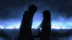 two people standing next to each other in front of a sky filled with stars and clouds