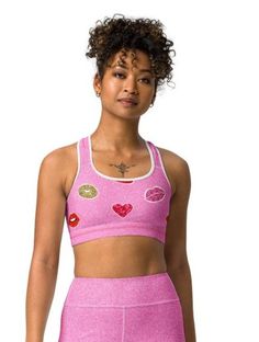 ABOUT Get ready to pucker up in this Valentine's Day-inspired sports bra! With a playful kiss print and comfortable fit, this bra will keep you supported and stylish during your workouts. Show off your fun and flirty side while staying active. (No puckering required!) Crafted with a breathable mesh fabric and unique cut-out design, this bra ensures maximum ventilation and comfort. The supportive straps and ribbed band provide added strength and stability, allowing you to reach your workout goals Kiss Print, Playful Kiss, Workout Goals, Shoulder Support, Staying Active, Padded Sports Bra, Cut Out Design, Clothing Labels, Workout Wear