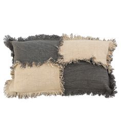 three different colored pillows with fraying on the sides, one black and one beige