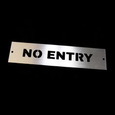 there is a metal sign that says no entry