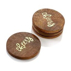 two wooden coasters with gold lettering on them