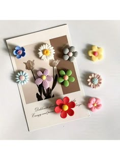 there are many different flowers on the card