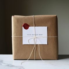 a wrapped present with a wax stamp on it