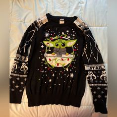 Brand New Baby Yoda Christmas Sweater With Tags. Size Large In Juniors From Kohl’s. Fitted Black Christmas Top, Fitted Black Top For Christmas, Baby Yoda Christmas, Yoda Christmas, Baby Sweaters, Christmas Sweater, New Baby, Colorful Sweaters, Christmas Sweaters