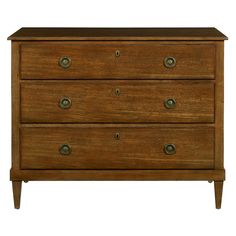 a wooden dresser with three drawers and two knobs