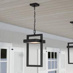 an outdoor light fixture hanging from the ceiling