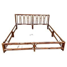 an old bamboo bed frame with two rails