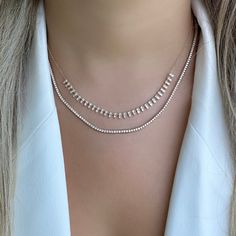 The mini version of our popular 14K gold tribal baguette drop diamond necklace. It offers an eye-catching look that will elevate any outfit. Handcrafted to ensure exceptional quality, this necklace features a unique combination of baguette and round diamonds, set in a tribal design that will add character and sparkle to any look. The luminous baguette diamonds capture the light beautifully, making it an elegant piece that is sure to become a timeless keepsake. Item Information Metal: 14k Gold We Luxury Delicate Baguette Cut Jewelry, Luxury Elegant Jewelry With Baguette Diamonds, Luxury Minimalist Jewelry With Baguette Diamonds, Luxury Evening Jewelry With Baguette Diamonds, Luxury Classic Baguette Cut Necklace, Luxury Everyday Baguette Cut Necklace, Luxury Baguette Diamond Wedding Necklaces, Luxury Diamond Baguette Necklace For Wedding, Luxury Baguette Cut Single Diamond Necklace