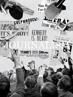 a group of people holding up their hands in front of a wall covered with newspapers