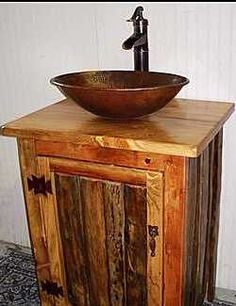 a sink made out of wood with a bowl on top