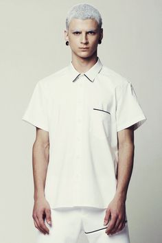 Mens Shirt // Unique Mens White Short Sleeve Button Down Dress Shirt by Eliran Nargassi has a minimalist design, a regular yet a bit slim fit silhouette through the body. Crafted in a high quality italian  cotton fabric; The shirt features one pocket to the chest with a black piping tape and also a classic button through placket with white buttons, a rounded hem and a classic collar with white piping tape.WE SHIP WORLDWIDE !The shirt is also available in Black: https://www.etsy.com/il-en/listing Store Uniform, Mens White Trousers, Mens White Shirt, Dress Shirt Short Sleeve, Androgynous Clothing, Men Minimalist Fashion, Mens White Dress Shirt, Black Dress Pants Men, Mens White Shorts