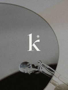 the letter k is etched into an object