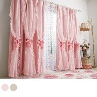 pink curtains with ruffles and bows on them