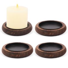 three wooden candles holders with one lit candle