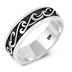 a wedding ring with an intricate design on the outside and black enamel in the inside