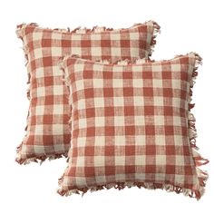 two red and white checkered pillows with fray edges