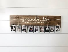 a wooden sign that says best mom ever with photos hanging from clothes pins on it