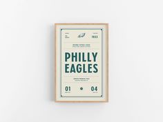 the phily eagles poster is mounted on a wall in front of a white background