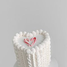 a heart shaped cake on top of a white plate