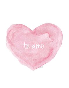 a pink heart with the word te amo written in white ink on it's side