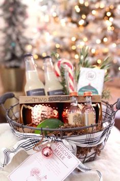 a basket filled with christmas gifts sitting on top of a table