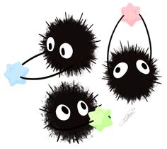 three black furry balls with one green and one pink