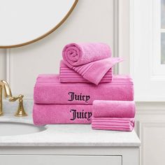 pink towels with the words juicy juicy on them