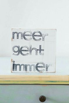 a sign that says, meet gent immer on top of an old dresser