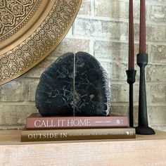 These Indonesian petrified wood bookends are crafted from unique wood that's been petrified over millions of years. Their natural beauty and solid weight make them the perfect accents for your favorite books. Their timeless, organic look will add a touch of natural beauty to any home or office space. Set of 2 bookends. Bookends are polished on both sides and feature a natural bark edge. Dimensions (side-to-side): 8" L x 2.25"W x 7"H Modern Rustic Office Decor, Modern Rustic Office, Rustic Office Decor, Bark Edge, Agate Bookends, Wood Bookends, Rustic Office, Wood Serving Board, Blue Onyx