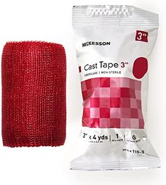 a red cloth next to a bag of tape on a white background with the package in front