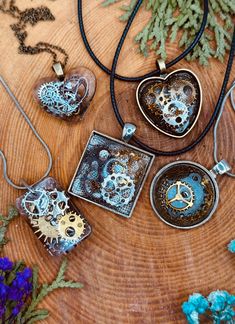 Discover the enchanting allure of vintage industrial art with our exclusive collection of Handmade Steampunk Resin Pendant Necklaces. Each pendant in this series is a unique masterpiece, meticulously crafted to showcase intricate gear and clockwork designs encased in high-quality resin. Perfect for steampunk enthusiasts, gearheads, and lovers of unique jewelry, these pendants make a striking addition to any collection. *Features **Handcrafted Elegance Every pendant is lovingly handmade, ensuring Vintage Upcycled Jewelry As Gift, Vintage Silver Electroformed Necklaces, Unique Upcycled Jewelry As A Gift, Unique Upcycled Jewelry Gift, Unique Upcycled Jewelry For Gifts, Polymer Clay Steampunk, Steampunk Aesthetic, Steampunk Pendant, Steam Punk Jewelry