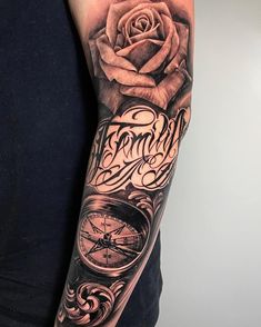 a man with a rose and compass tattoo on his arm