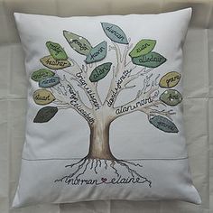 a white pillow with a family tree on it