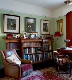 a living room filled with furniture and bookshelves covered in lots of different types of books