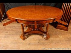 a wooden table with two chairs next to it