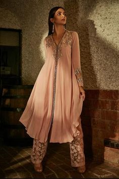 Blush pink A-line kurta with floral sequin, cutdana embroidered motifs. Paired with floral embroidered pant. Tunic With Pants, A Line Kurti, Embellished Neckline, Embroidery Detailing, A Line Kurta, Pakistan Fashion, Sanya, Embroidery Designs Fashion, Sharara Set