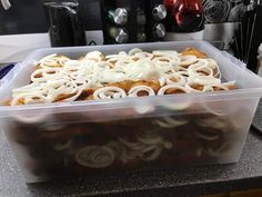 a plastic container filled with food sitting on top of a counter