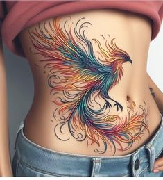 a woman's stomach with a colorful bird tattoo on it