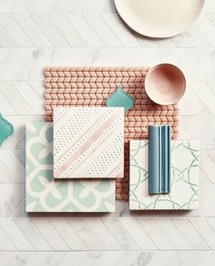 an overhead view of kitchen utensils, plates and cups on the counter top