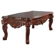 an ornately carved wooden table on white background