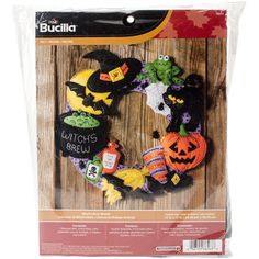 the crafty kit includes a mickey mouse wreath with witches and pumpkins on it