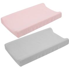 two baby crib mattresses, one pink and the other grey with pleated edges