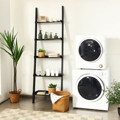 a washer and dryer sitting next to each other in a room