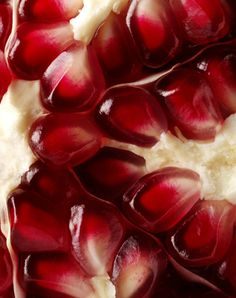 a close up view of a pomegranate that has been cut in half