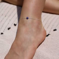 A delicate anklet with blue evil eye bead - as fine as can be, must-have for the summer season. Protect me - Evile eye. Made of high-quality 925 sterling silver. arrive with 3 cm extender chain You will receive a 1-year warranty. Item will arrive in pretty gift packaging, ready to give. 0.6 mm sterling silver Cardano chain. Lobster clasp. available in 2 lengths: 20 cm + 3 cm extender chain 23 cm + 3 cm extender chain Dainty Sterling Silver Anklets For Summer, Dainty Adjustable Sterling Silver Anklets, Minimalist Hypoallergenic Sterling Silver Anklets, Handmade Minimalist Anklet For Gift, Minimalist Handmade Anklet As Gift, Minimalist Handmade Anklet For Gift, Adjustable Hypoallergenic Sterling Silver Anklets, Minimalist Anklet, Black Anklet