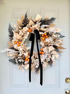 a wreath is hanging on the front door