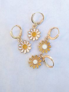 ~ cute daisy flower earrings ~ - gold-plated hoop earrings with cute daisy flowers - a small gift for loved ones or make yourself happy - the cute earrings are approx. 3 cm long Cute Flower Earrings, Trendy Gold Flower Charm Earrings, Trendy Gold Hoop Earrings With Flower Charm, Cute Gold Jewelry For Spring, Cute Gold Jewelry With Flower Charm, Gold Flower Charm Earrings For Summer, Spring Gift Yellow Gold Earrings, Spring Yellow Gold Earrings Gift, Yellow Gold Earrings For Spring Gift