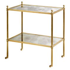 a gold metal and glass side table with two shelves on each side, one shelf is empty